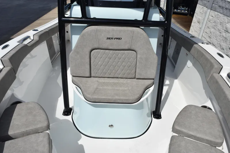 Slide: The Image of 2023 Sea Pro 219 Deep V CC boat interior with cushioned seating and sleek design. - 13