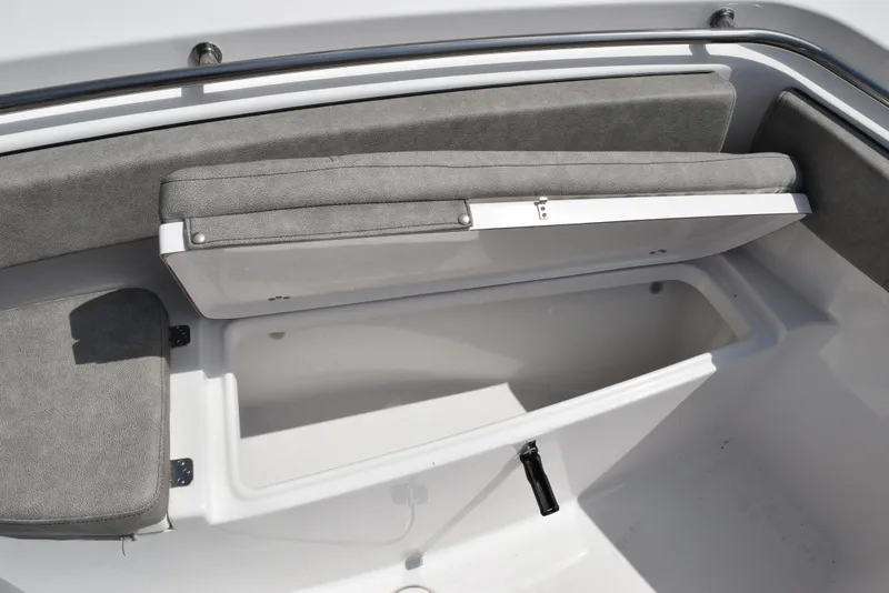 Slide: The Image of 2023 Sea Pro 219 Deep V CC boat with open storage compartment and cushioned seating. - 16