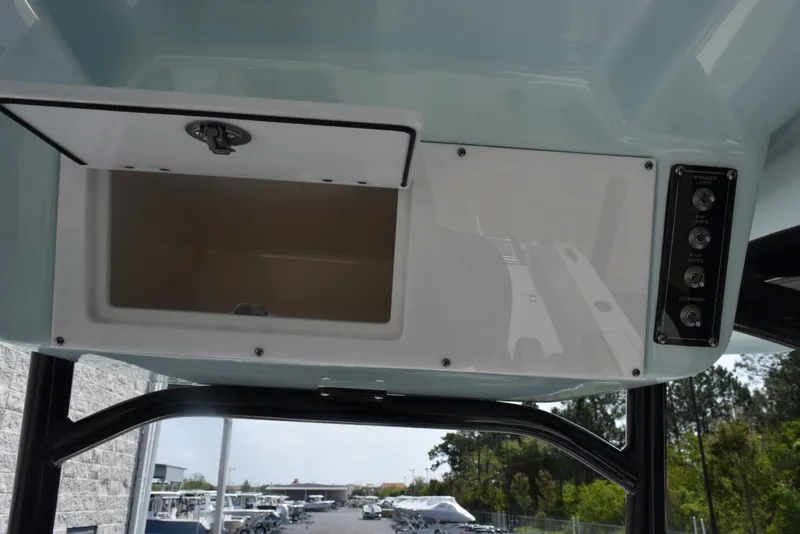 Slide: The Image of 2023 Sea Pro 219 Deep V CC boat console storage and control panel. - 21