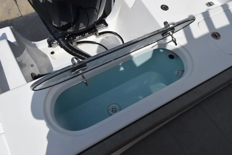 Slide: The Image of 2023 Sea Pro 219 Deep V CC boat livewell with open lid. - 23