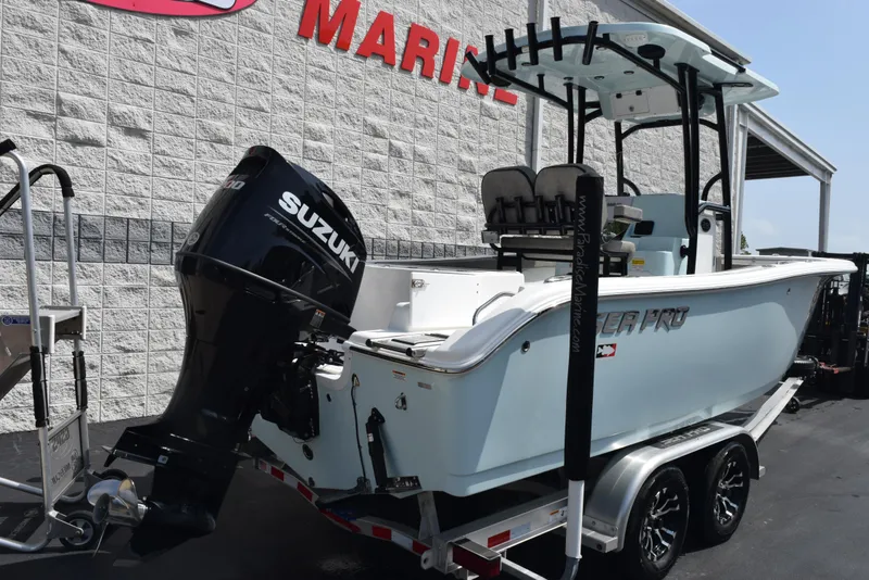 Slide: The Image of 2023 Sea Pro 219 Deep V CC boat with Suzuki outboard motor on trailer. - 3