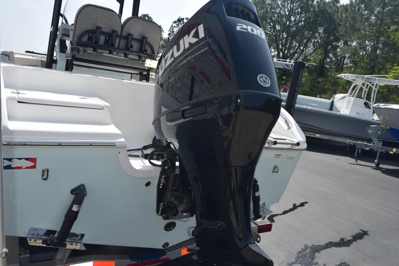 Slide: The Image of 2023 Sea Pro 219 Deep V CC with Suzuki 200 outboard motor, parked outdoors. - 5