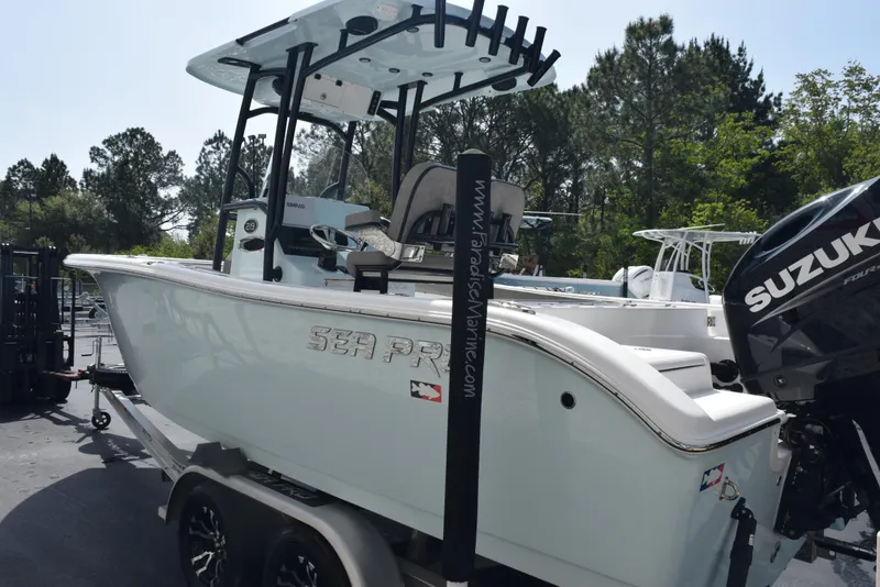 Slide: The Image of 2023 Sea Pro 219 Deep V CC boat with Suzuki outboard motor on trailer. - 6