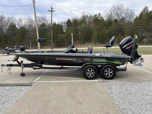 Slide: The Image of 2014 Phoenix Bass Boats 920 ProXP on trailer, parked outdoors. - 13