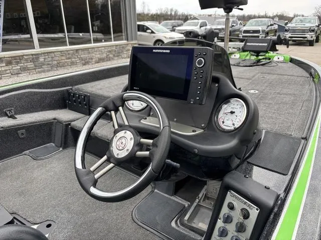 Slide: The Image of 2014 Phoenix Bass Boats 920 ProXP cockpit with steering wheel and navigation display. - 5