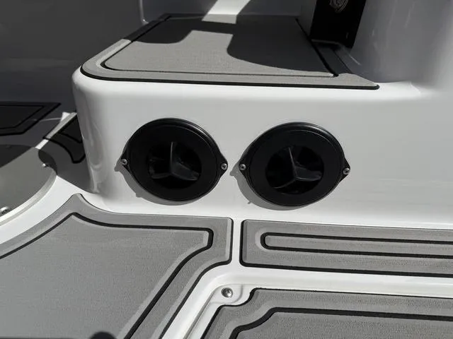 Slide: The Image of 2025 Moomba Max boat interior with dual cup holders and sleek design. - 14