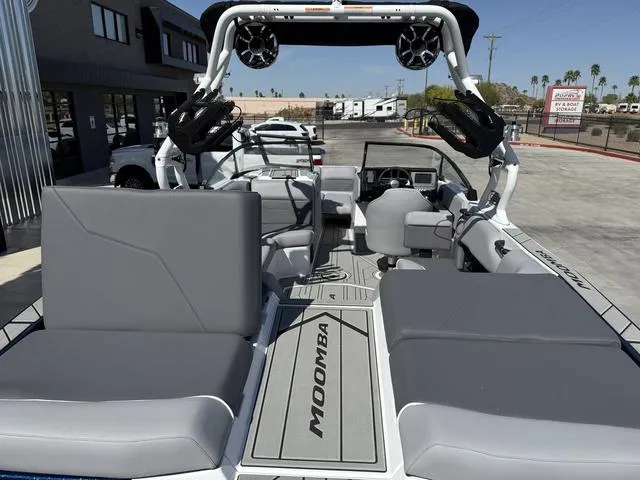 Slide: The Image of 2025 Moomba Max boat interior with gray seating and modern design. - 9