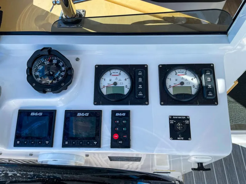 Slide: The Image of Control panel of 2023 Seawind 1260 catamaran with gauges and navigation instruments. - 13