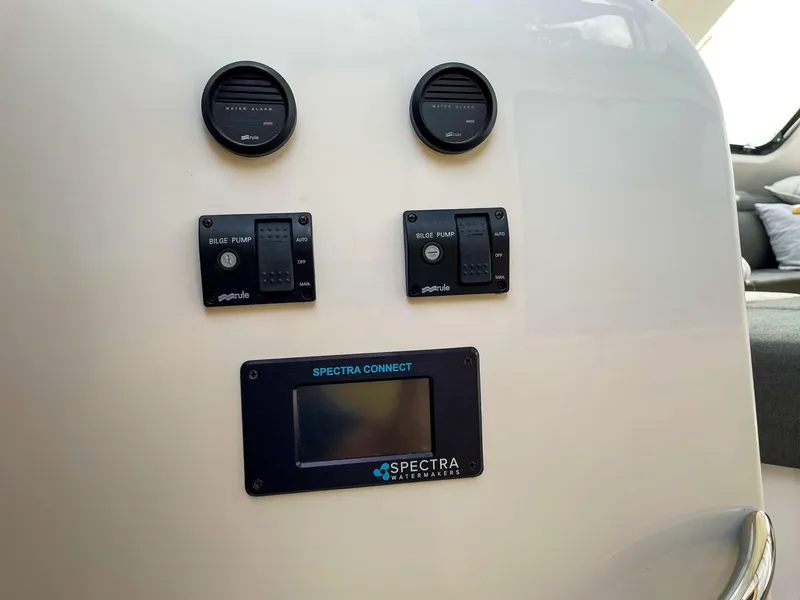 Slide: The Image of Control panel of 2023 Seawind 1260 with bilge pump and Spectra Connect display. - 14