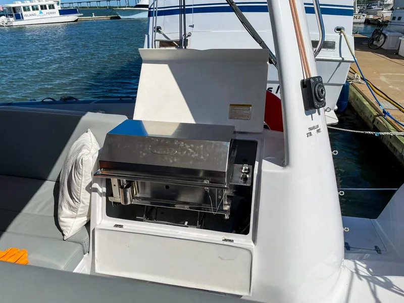 Slide: The Image of Seawind 1260 yacht with outdoor grill, docked at marina, 2023 model. - 15