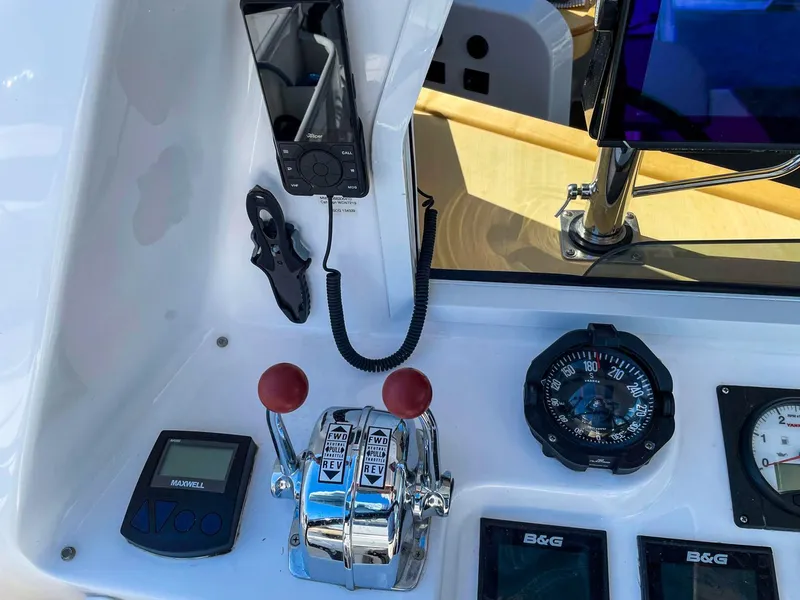 Slide: The Image of 2023 Seawind 1260 cockpit controls with compass, throttle, and navigation instruments. - 16