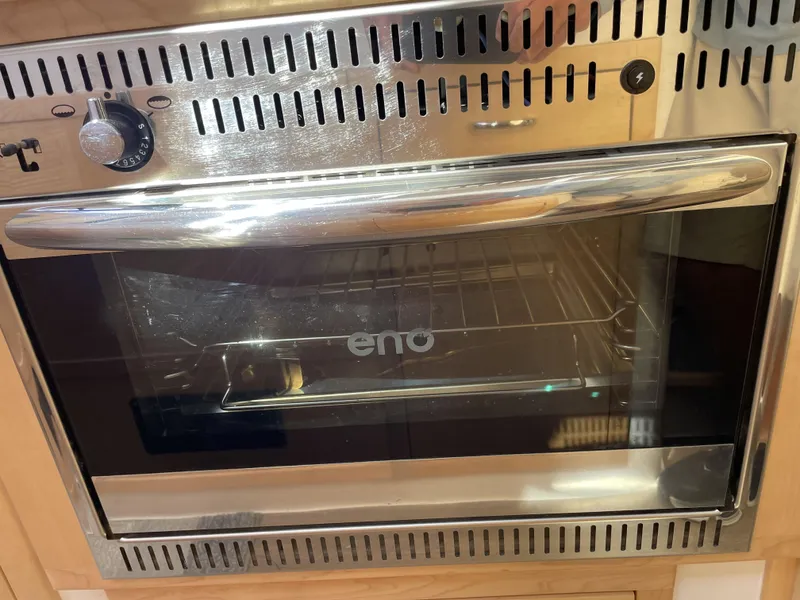 Slide: The Image of Stainless steel oven with "eno" logo, installed in a 2023 Seawind 1260 yacht. - 21