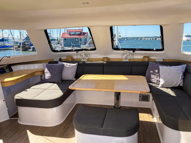 Slide: The Image of Interior of 2023 Seawind 1260 catamaran with spacious seating and large windows. - 34