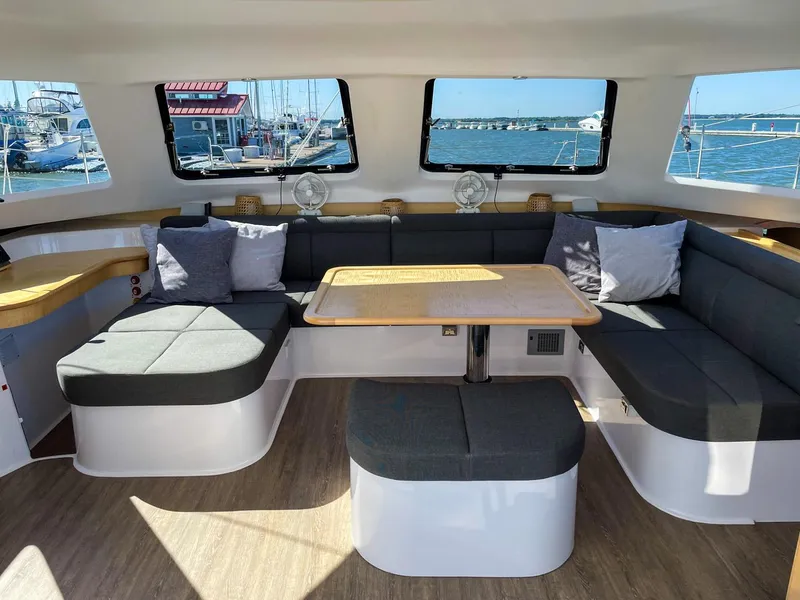 Slide: The Image of Luxurious interior of 2023 Seawind 1260 catamaran with spacious seating and panoramic windows. - 35