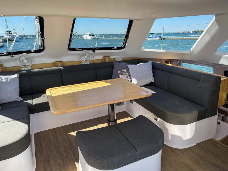 Slide: The Image of Modern interior of 2023 Seawind 1260 catamaran with spacious seating and ocean view. - 36