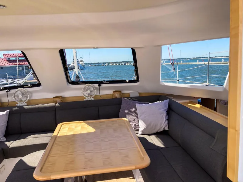 Slide: The Image of Interior of 2023 Seawind 1260 catamaran with cozy seating and ocean view. - 40