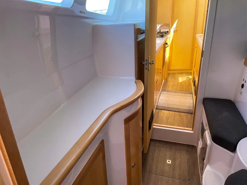 Slide: The Image of 2023 Seawind 1260 yacht interior with modern kitchen and seating area. - 47