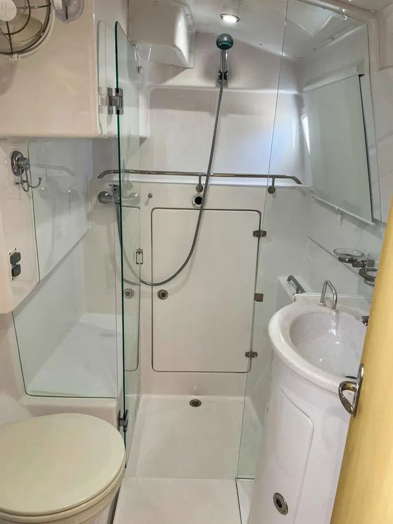 Slide: The Image of Modern bathroom in 2023 Seawind 1260 yacht with shower, sink, and toilet. - 55