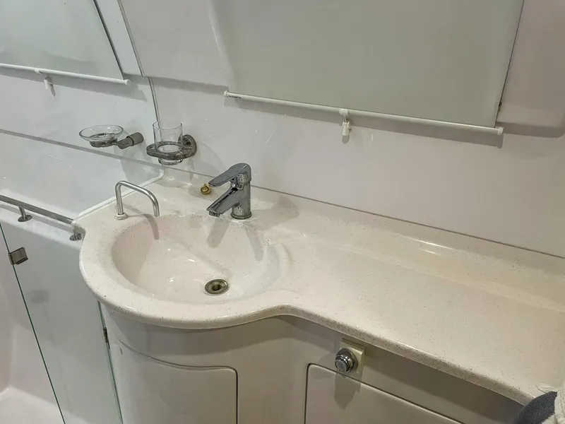 Slide: The Image of Modern bathroom sink in 2023 Seawind 1260 yacht, featuring sleek design and fixtures. - 56