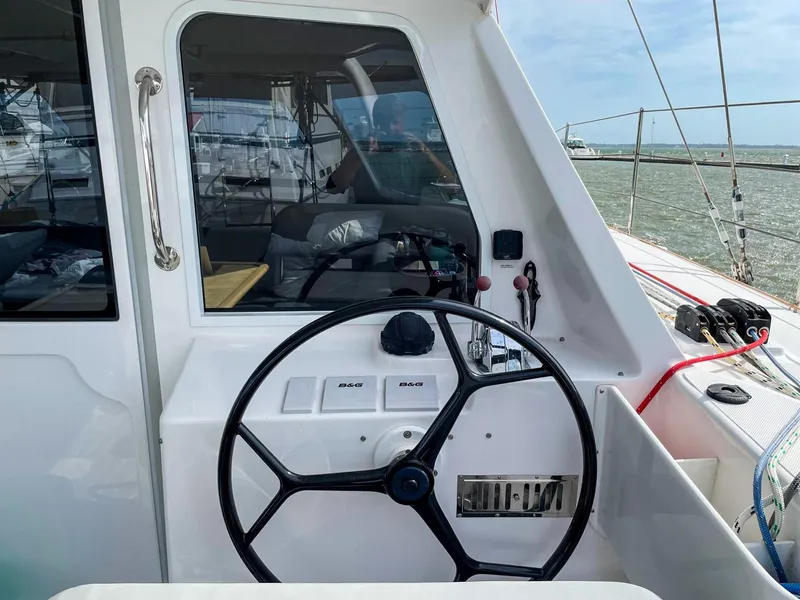 Slide: The Image of Helm of 2023 Seawind 1260 catamaran with steering wheel and control panel. - 6