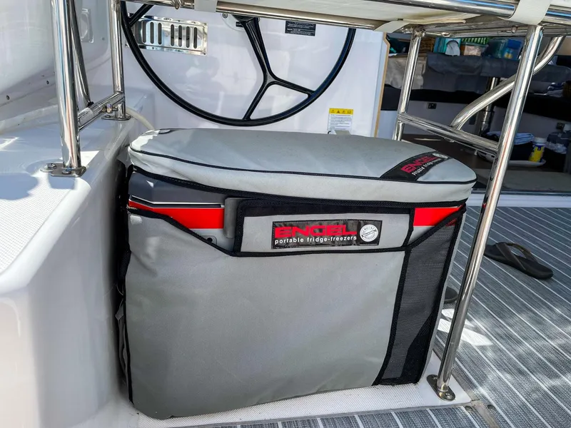 Slide: The Image of Engel portable fridge-freezer on 2023 Seawind 1260 yacht, near steering wheel. - 9