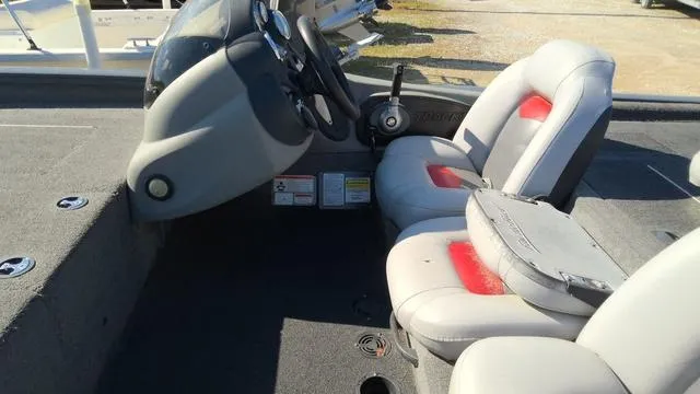 Slide: The Image of 2016 Tracker Pro Team™ 190 TX boat interior with steering console and seating. - 4