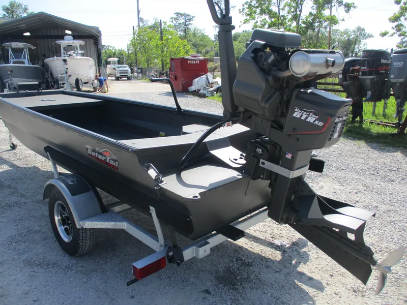 Slide: The Image of 2025 Gator Tail 1748 GATOR boat on trailer, parked outdoors. - 2