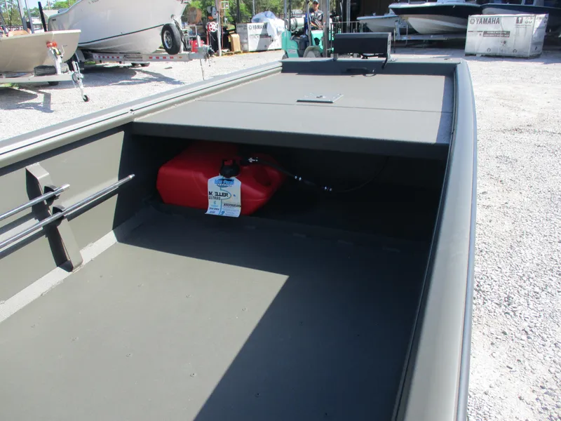 Slide: The Image of 2025 Gator Tail 1748 GATOR boat with red fuel tank, parked outdoors. - 6