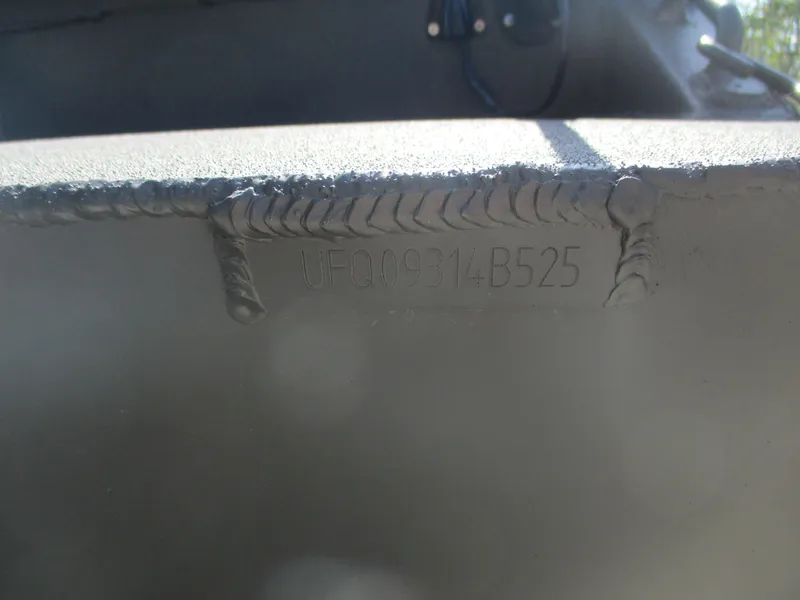 Slide: The Image of Close-up of 2025 Gator Tail 1748 GATOR boat hull with visible welds and serial number. - 7