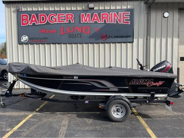 Slide: The Image of 2016 Alumacraft Classic 165 TL boat with cover at Badger Marine dealership. - 1
