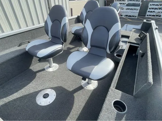 Slide: The Image of 2016 Alumacraft Classic 165 TL boat interior with four gray and white seats. - 14