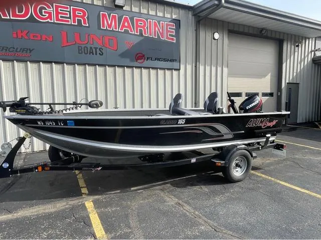 Slide: The Image of 2016 Alumacraft Classic 165 TL boat on trailer outside Badger Marine dealership. - 2