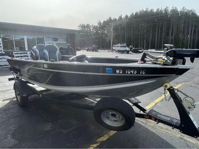 Slide: The Image of 2016 Alumacraft Classic 165 TL boat on trailer in parking lot. - 3