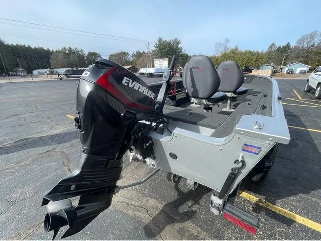 Slide: The Image of 2016 Alumacraft Classic 165 TL boat with Evinrude motor in parking lot. - 6