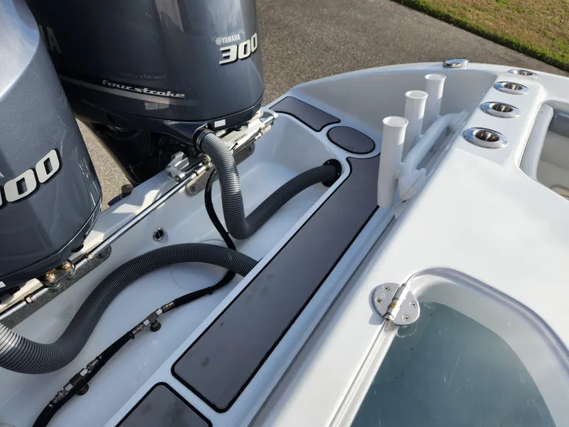 Slide: The Image of 2017 Yellowfin 34 Offshore boat with dual Yamaha 300 engines, featuring rod holders and storage compartments. - 17