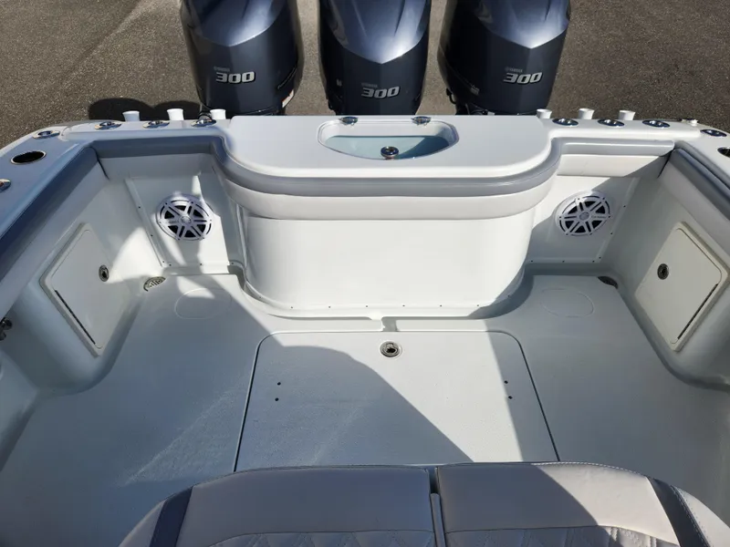 Slide: The Image of 2017 Yellowfin 34 Offshore boat deck with triple 300 engines. - 19
