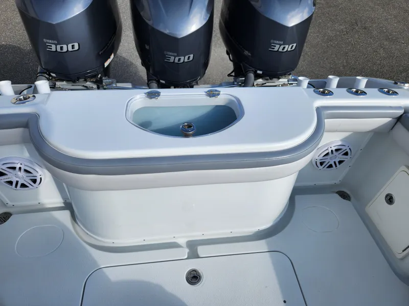 Slide: The Image of 2017 Yellowfin 34 Offshore boat with triple 300 horsepower engines and spacious deck layout. - 24