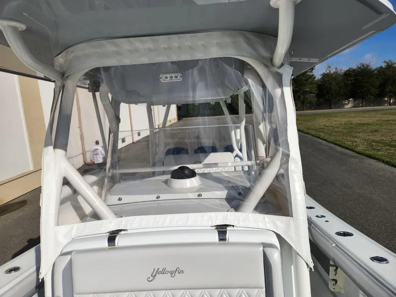 Slide: The Image of 2017 Yellowfin 34 Offshore boat with enclosed helm, parked outdoors. - 36