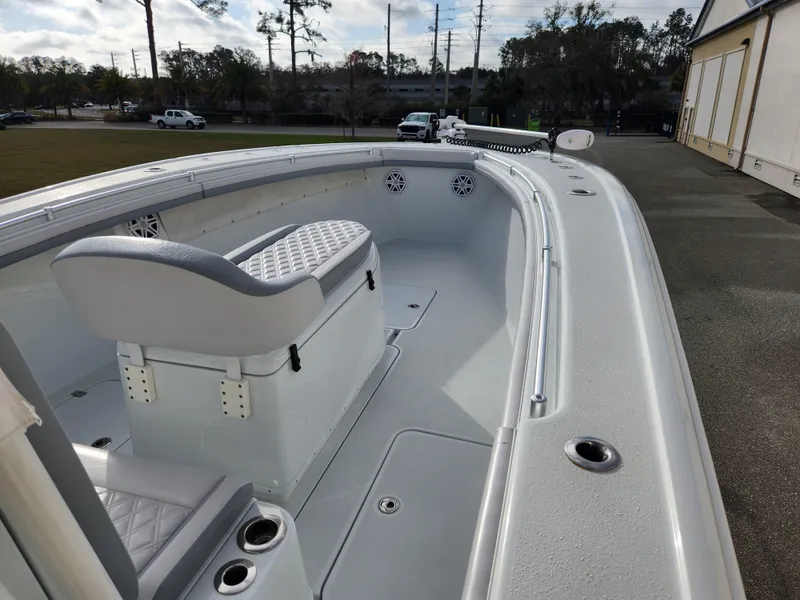 Slide: The Image of 2017 Yellowfin 34 Offshore boat interior with seating and rod holders. - 41