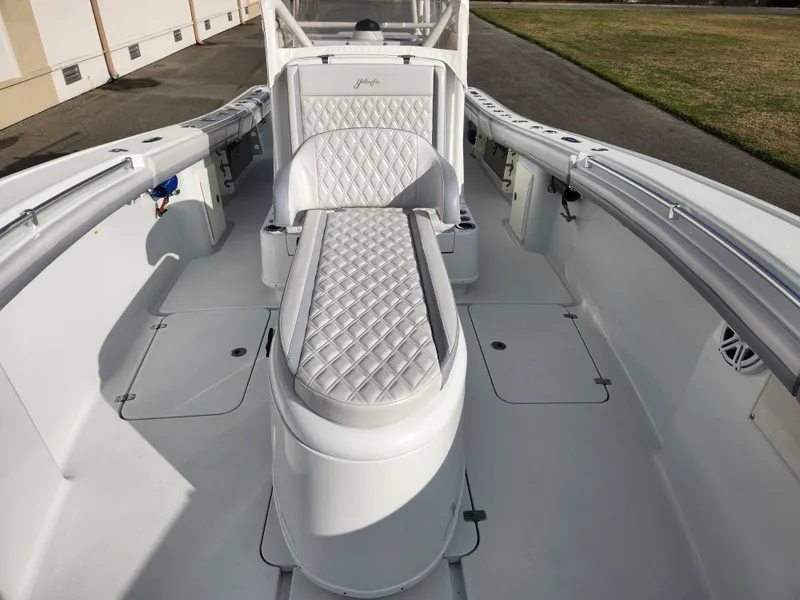 Slide: The Image of 2017 Yellowfin 34 Offshore boat interior with white quilted seating. - 46