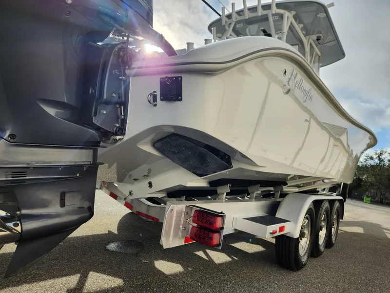 Slide: The Image of 2017 Yellowfin 34 Offshore boat on a trailer, viewed from the rear. - 9