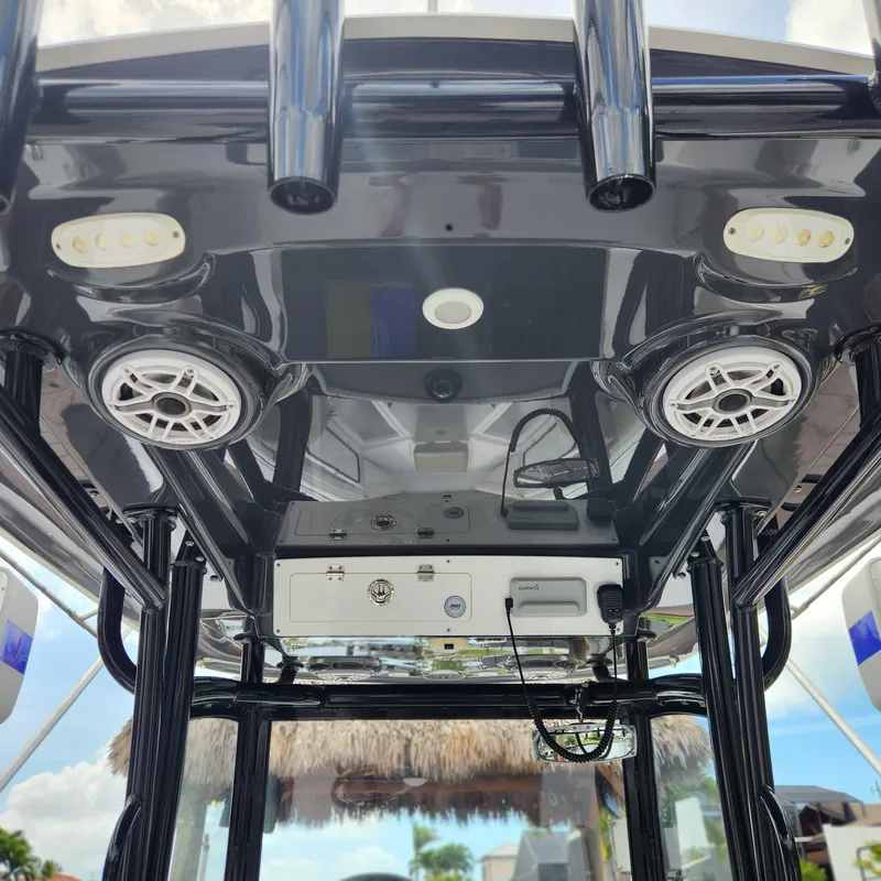 Slide: The Image of 2021 Sportsman Open 252 Center Console boat interior with speakers and electronic controls. - 14