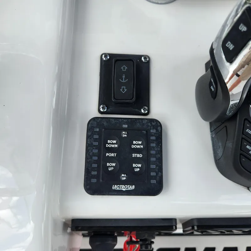 Slide: The Image of Control panel of a 2021 Sportsman Open 252 Center Console boat. - 22