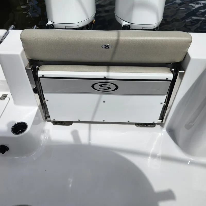 Slide: The Image of 2021 Sportsman Open 252 Center Console boat seat and storage compartment. - 24