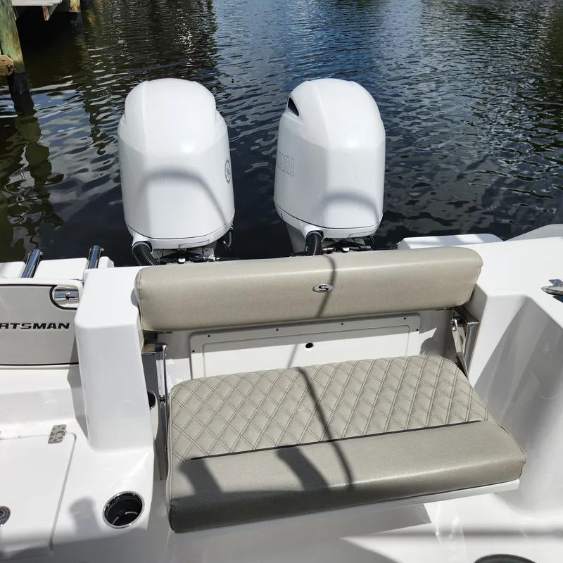 Slide: The Image of 2021 Sportsman Open 252 Center Console boat with twin engines and cushioned seating. - 29
