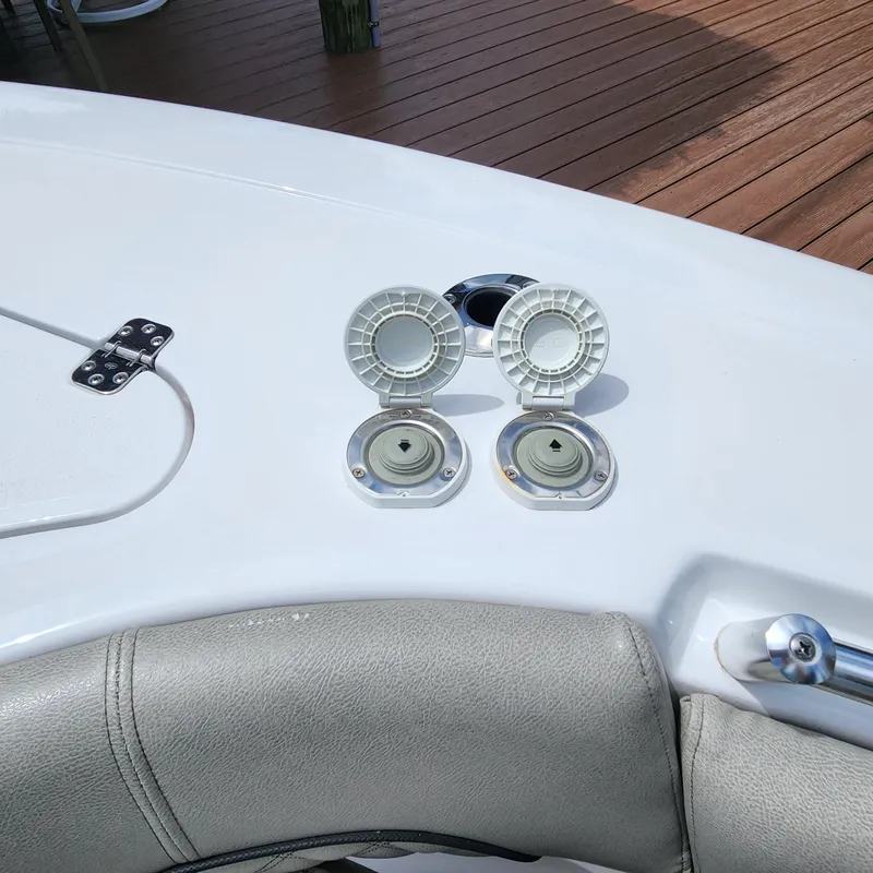 Slide: The Image of 2021 Sportsman Open 252 Center Console boat deck with open hatches and seating. - 34