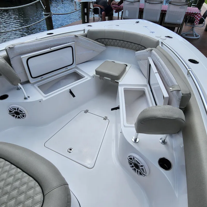 Slide: The Image of 2021 Sportsman Open 252 Center Console boat interior with seating and storage compartments. - 36