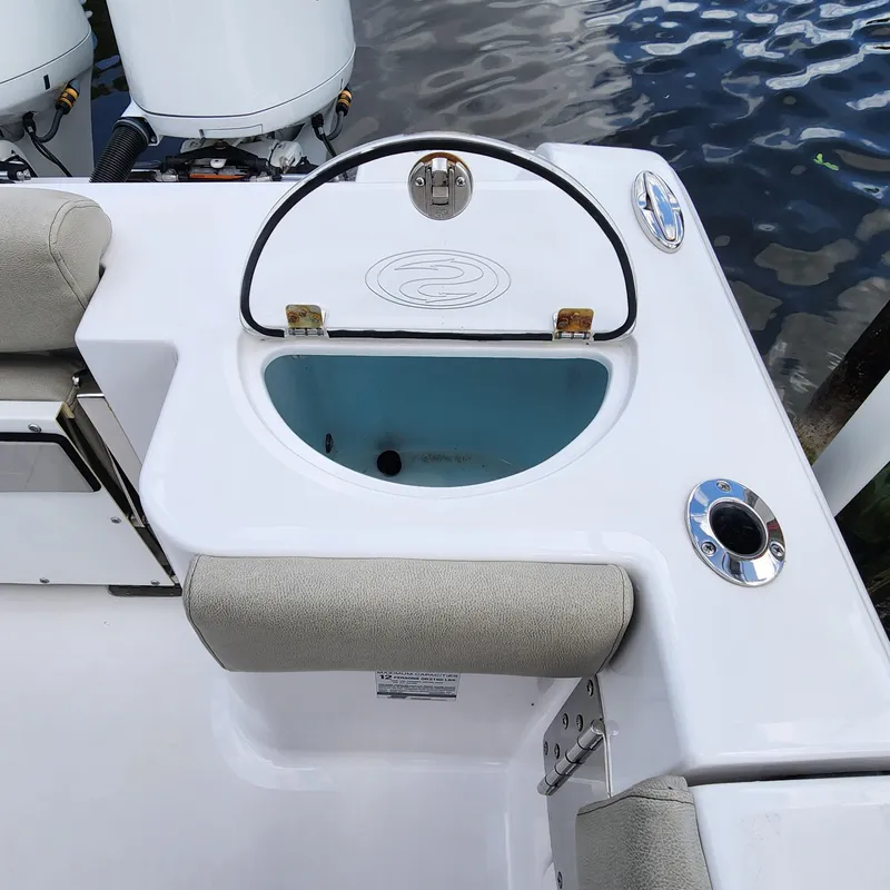 Slide: The Image of 2021 Sportsman Open 252 Center Console boat with livewell and seating. - 39