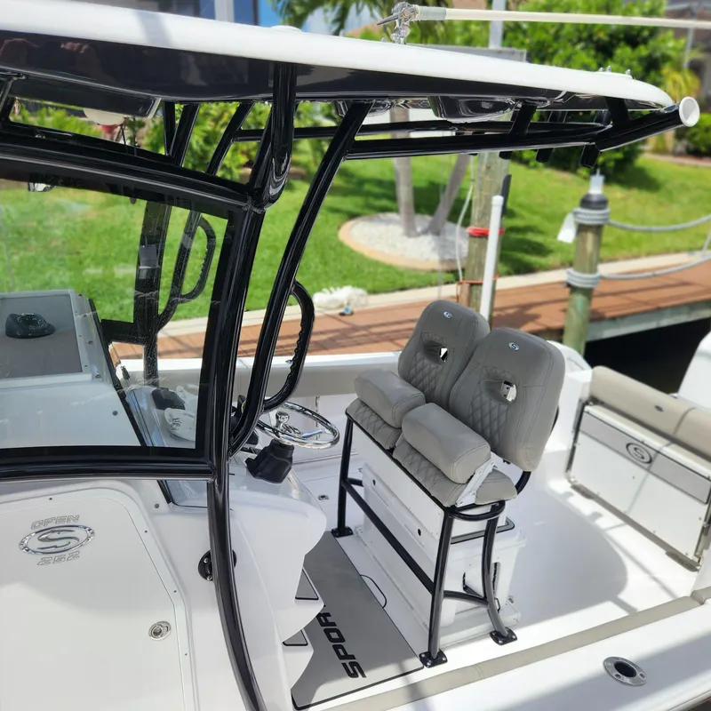Slide: The Image of 2021 Sportsman Open 252 Center Console boat interior with seating and steering wheel. - 7