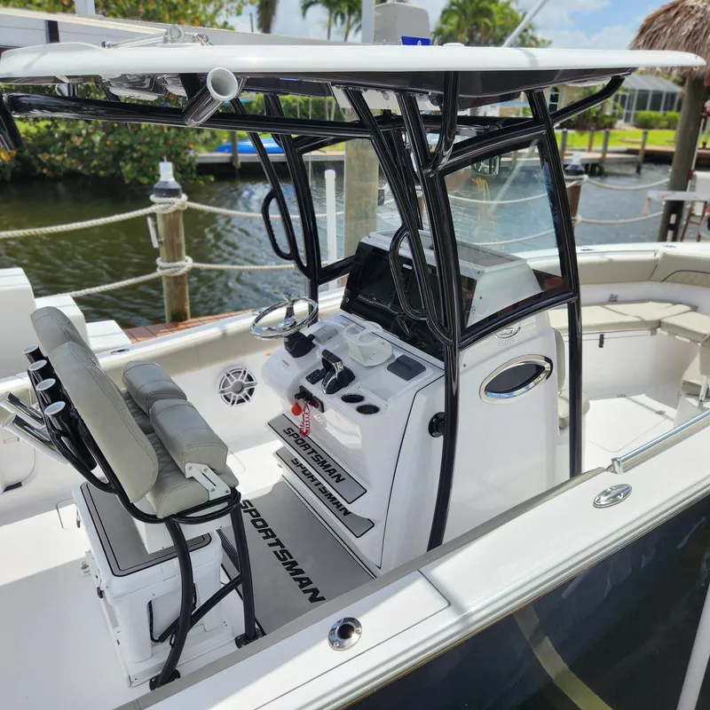 Slide: The Image of 2021 Sportsman Open 252 Center Console boat with sleek design and modern controls. - 8